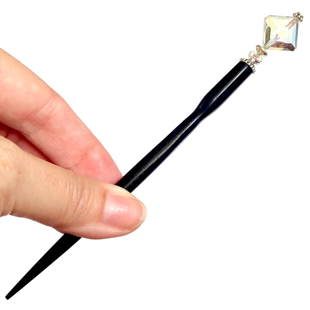 A full shot of our standard size Penelope Hair Stick made from a faceted glass bead