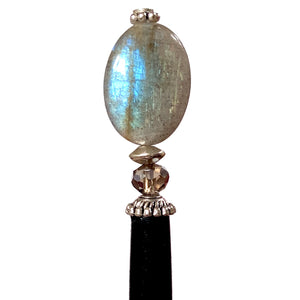 A close up of the Malia Tidal Hair Stick made from gray Labradorite stone beads