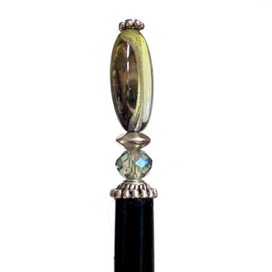 A close up of our Brooke Hair Stick made from green -blue ombre Czech glass beads