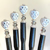 A set of five of our handmade Bailey hair sticks made with a metal dog paw print bead and Swarovski crystal.
