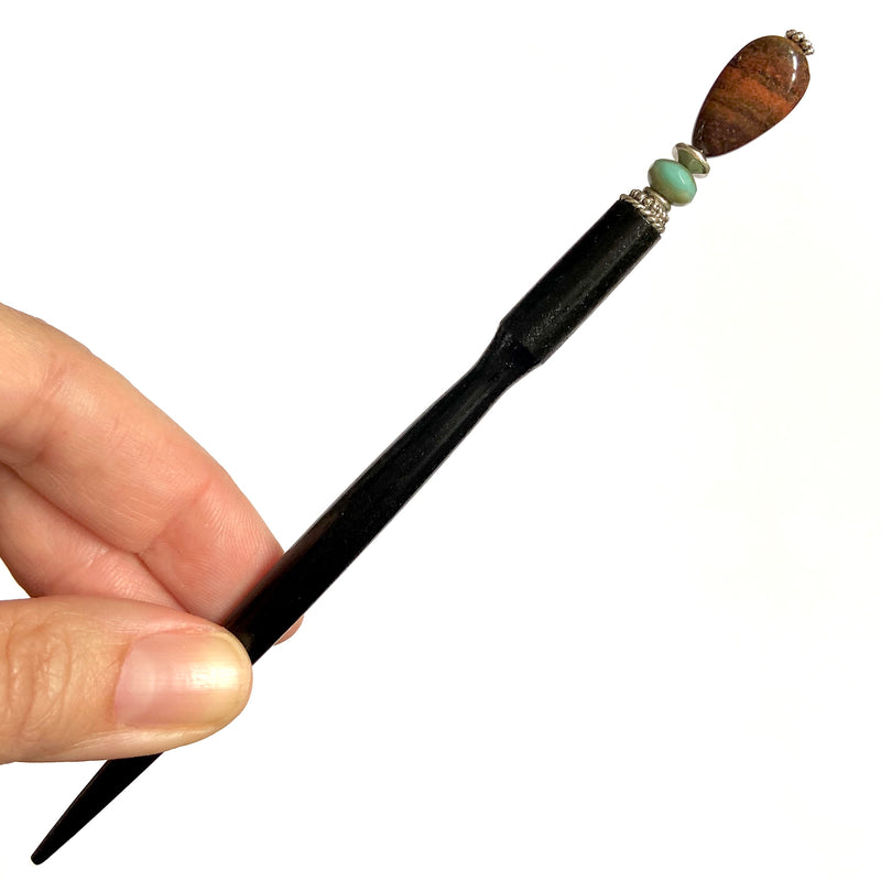 A close up of the Bree Tidal Hair Stick made from a teardrop Jasper bead