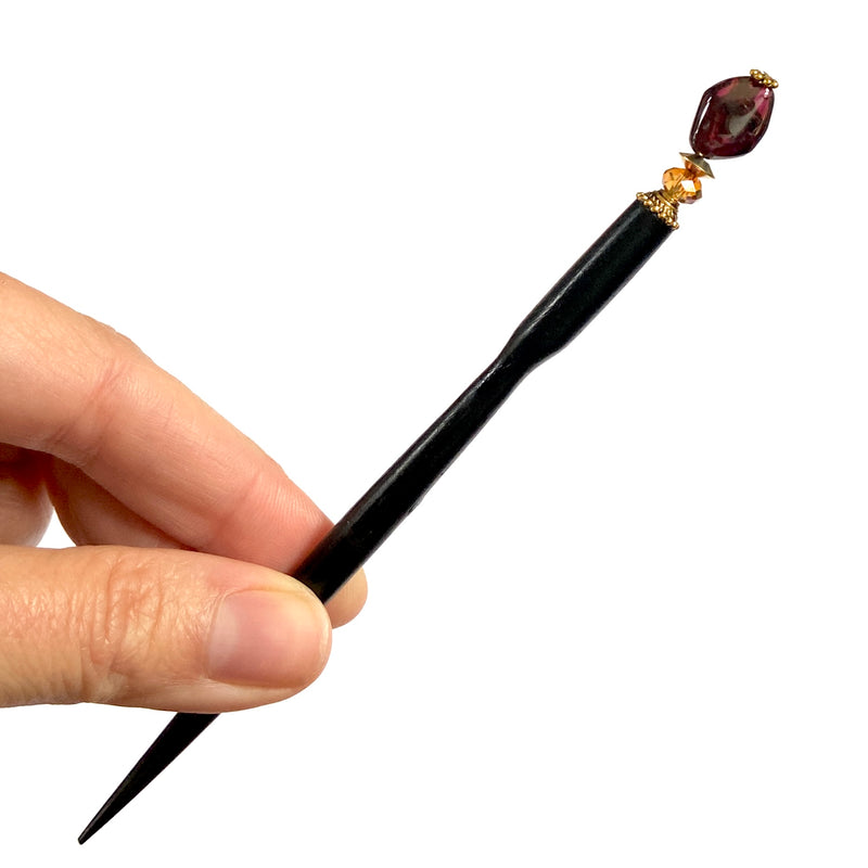 A close up of our Gia Hair Stick made from natural garnet nuggets and Swarovski crystals.