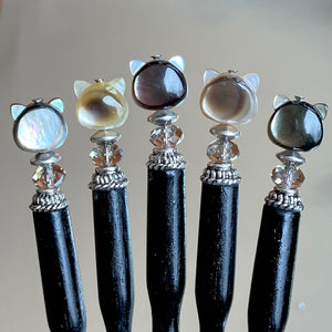 Five of our Kat Hair Sticks made from black mother of pearl cat beads