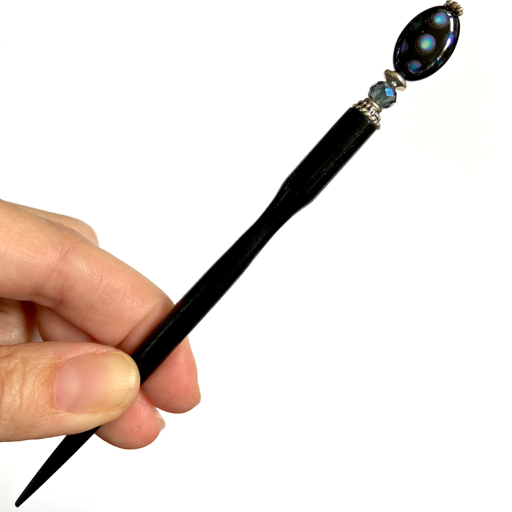 A full picture of the Melanie Tidal Hair Stick made from black Czech glass beads.