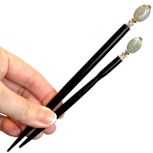 The large and standard size A close up of the Malia Tidal Hair Stick made from gray Labradorite stone beads.