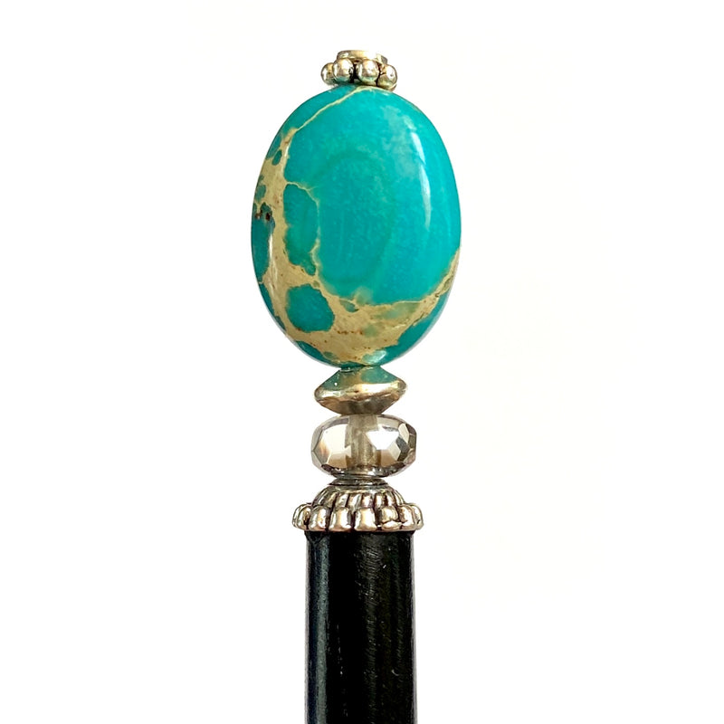 A close up of the Terra Tidal Hair Stick made from blue Jasper stone beads