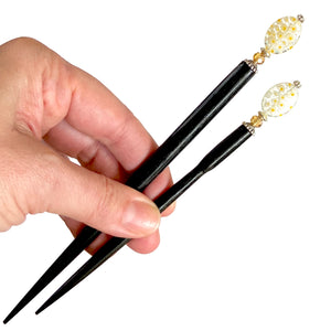 The standard and large sizes of the Emerson Hair Stick made from transparent white oval Czech glass beads with yellow flowers. 
