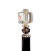 A close up of the Nicole Tidal Hair Stick made with an iridescent clear square bead and crystal accent