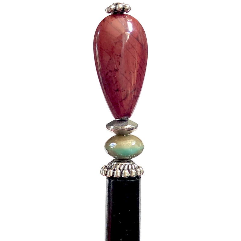 A close up of the Bree Tidal Hair Stick made from a teardrop Jasper bead