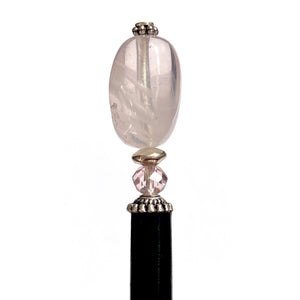 A close up of our Riley Hair Stick made from rose quartz stone