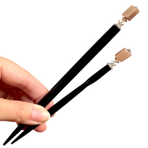 The standard and large sizes of the Farah Hair Sticks