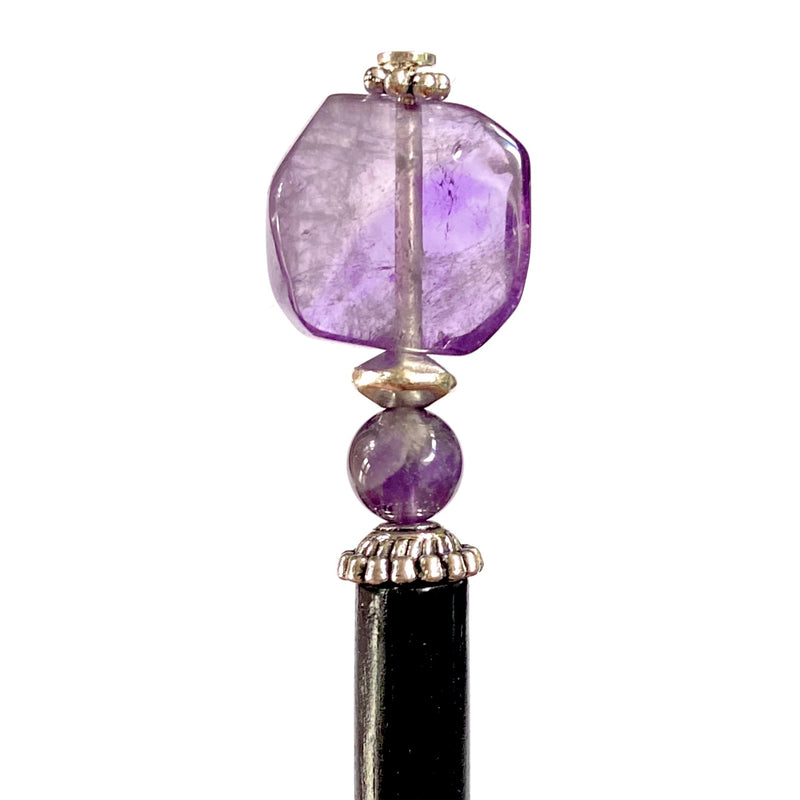 A close up of our Violet Hair Stick made from natural amethyst stone