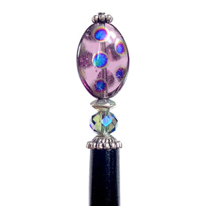 A close up of the Juno Tidal Hair Stick made from purple Czech glass beads
