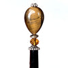 A close up of our Nisha hair stick made from Tiger's Eye stone. 