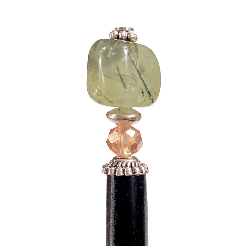 A close up view of the Vera Tidal Hair Stick made of yellow green Prehnite Stone beads