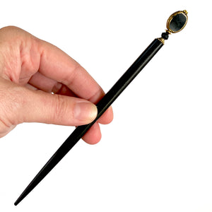 The large size of our Trinity hair sticks made from gold rimmed black Czech glass beads.  