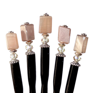 A set of five of our peach moonstone hair sticks