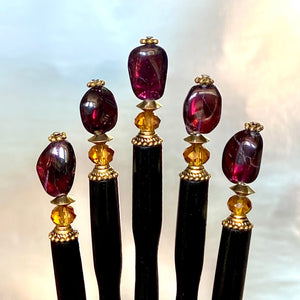 A set of five Gia sticks made from garnet nuggets. 