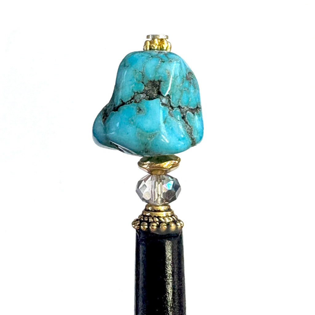 A close up view of the Indie Tidal Hair Stick made with turquoise Magnesite nuggets.