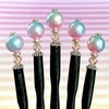 Five of our Olivia Hair Sticks made from pastel pink and blue acrylic bubblegum beads.