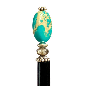 A close up of the Terra Tidal Hair Stick made from blue Jasper stone beads