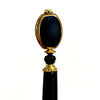 A close up of our Trinity hair sticks made from gold rimmed black Czech glass beads.  