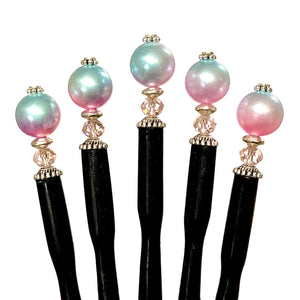 Five of our Olivia Hair Sticks made from pastel pink and blue acrylic bubblegum beads.