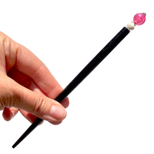 The large size of our Chelsea Hair Stick made with hot pink crackle glass beads