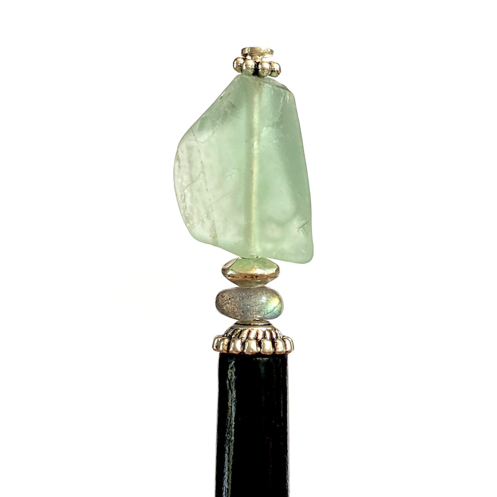 A close up of our Kira Tidal Hair Stick made from green fluorite nugget stone