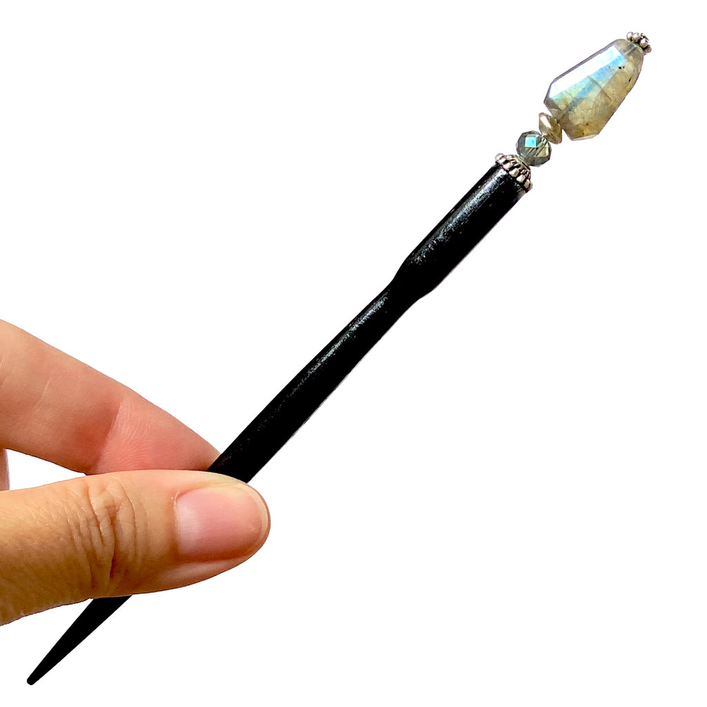 The standard size of the Dylan Tidal Hair Stick made from faceted labradorite nugget stone.