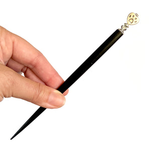 The large size of our Bailey Hair Stick made with a heart-shaped dog paw print metal bead and Swarovski crystal.