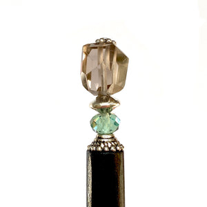 Another close up  of our Blake Hair Stick made from a brown Smoky Quartz Stone with a Swarovski Erinite Crystal.