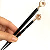 The standard and large sizes of the Cali Tidal Hair Stick made from a natural shell bead and pearl accent bead