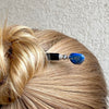 A woman wears one of our Chloe Tidal hair Sticks made from Lapis Lazuli Nuggets