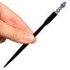 A full shot of our Claudia Hair Stick made from Tanzanite Stone and matching Swarovski crystal.