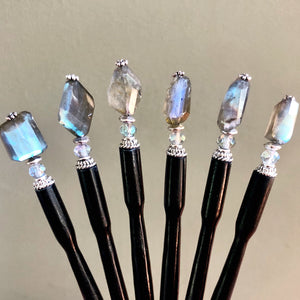 A grouping of six Dylan Hair Sticks made with Faceted Labradorite stones.
