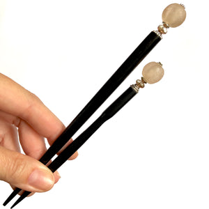 The standard and large sizes of the Ellen Hair Stick made from blush pink African Recycled Glass beads.