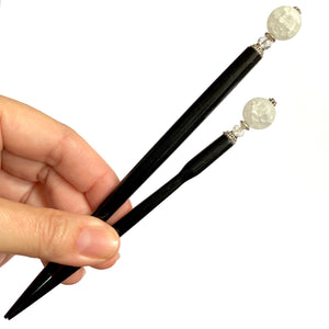 The standard and large sizes of the the Elodie Hair Stick made from frosted white crackle quartzite beads.