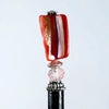 The Eve Tidal Hair Stick made from pink mother of pearl shell beads.