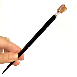 The large size of the Eve Tidal Hair Stick made from pink mother of pearl shell beads.