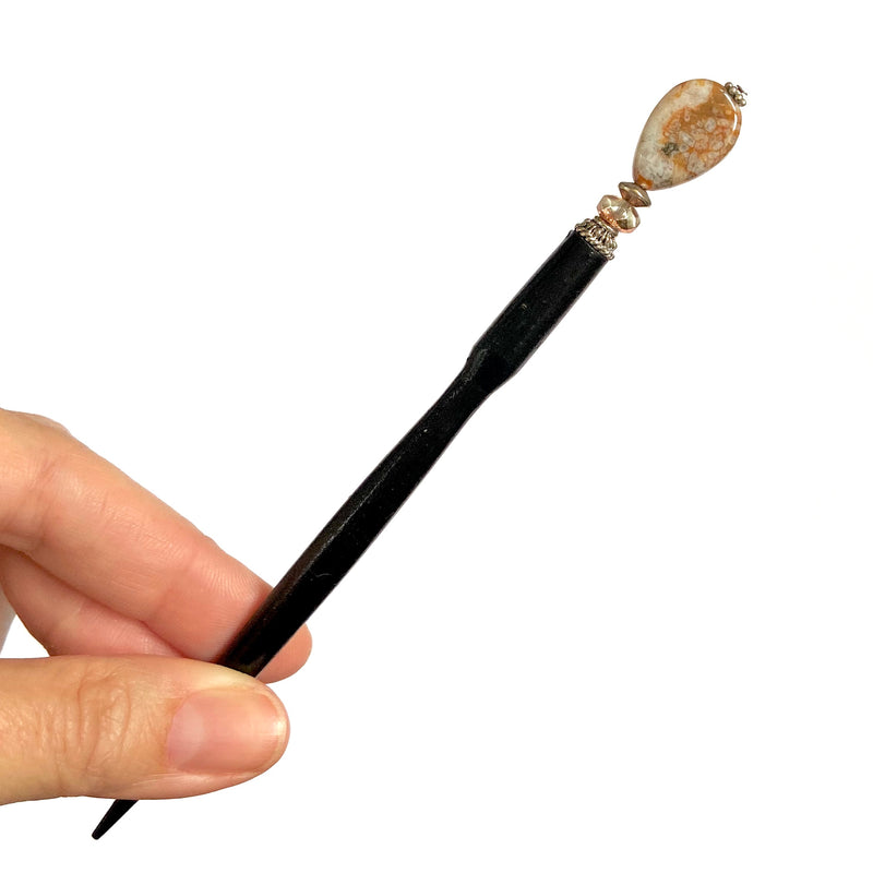 A close up of the Gemma Tidal Hair Stick made from Bamboo Agate Stone beads