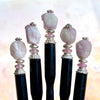 Five of our Hailey Hair Sticks made from lilac-colored Kunzite nuggets.