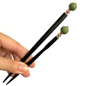 The standard and large sizes of the Harlow Hair Sticks