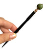 A full picture of the Harlow Tidal Hair Stick made from green raku fired ceramic beads.