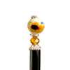 A close up of our Helia Hair stick made from a sunflower ceramic bead