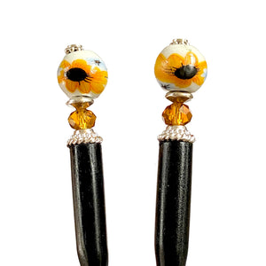 Two  of our Helia Hair sticks made from a sunflower ceramic bead