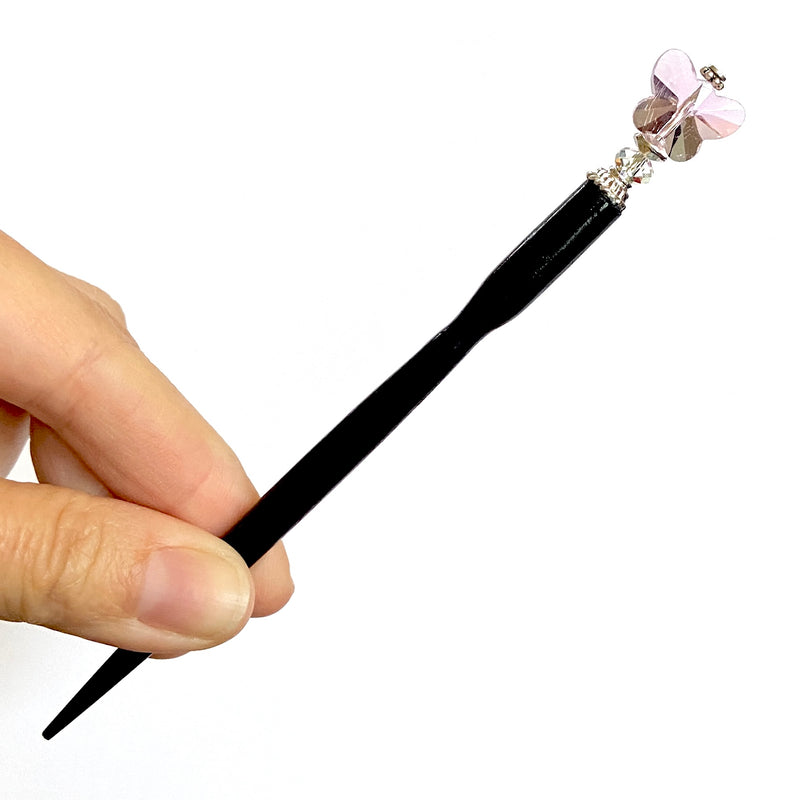 The large size of our pink Iris Hair Stick