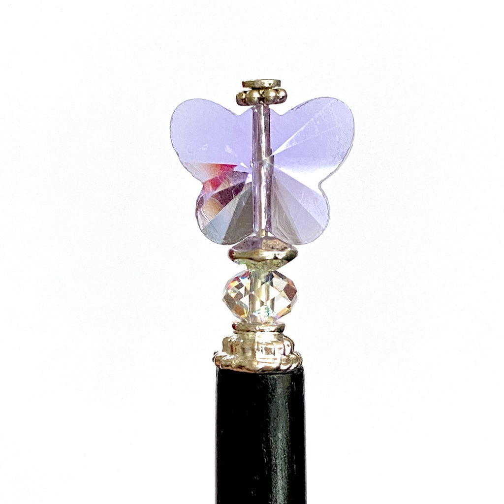 A close up of our purple Iris Hair Stick made from crystal