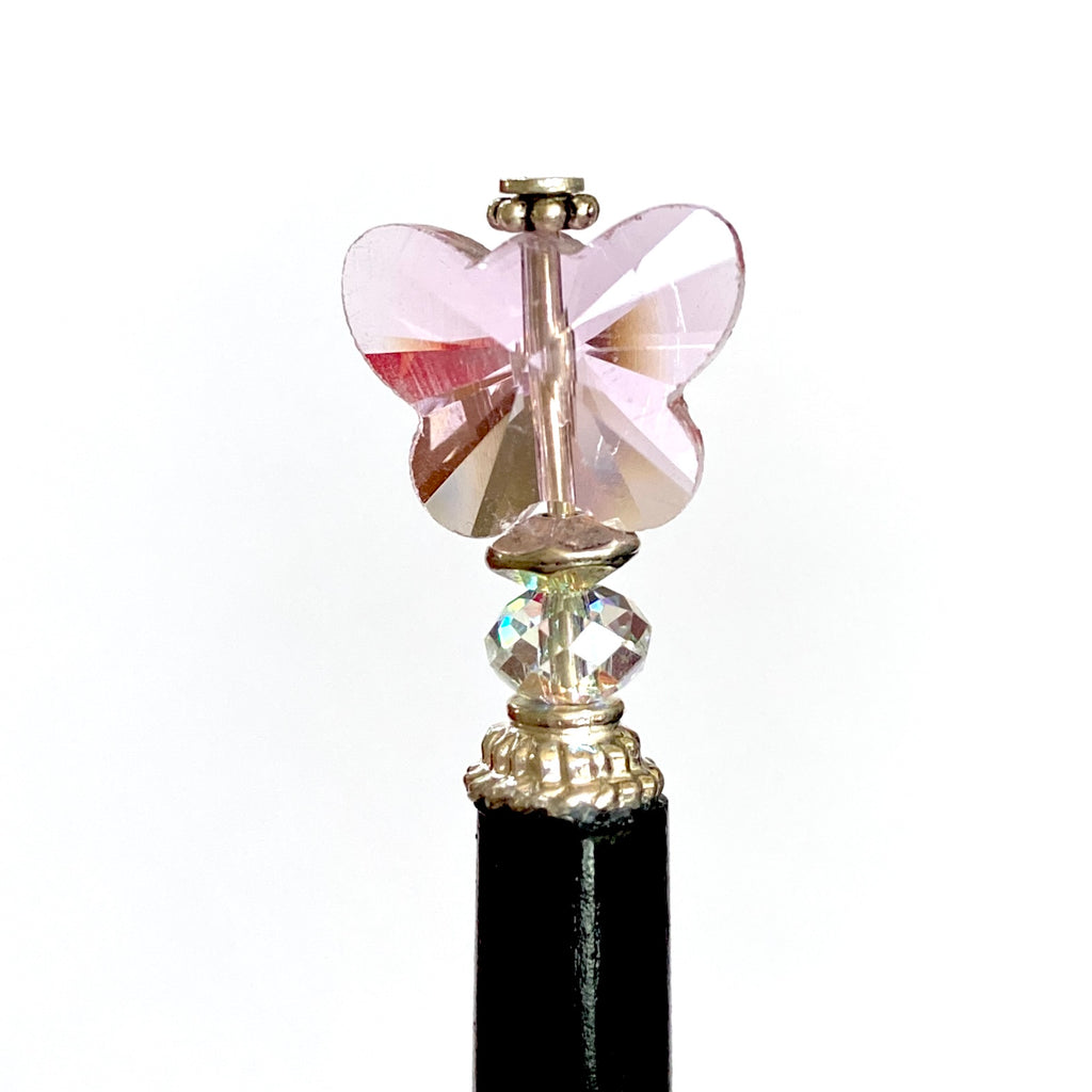 A close up of our pink Iris Hair Stick made from crystal