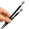 The standard and large sizes of the Juno Tidal Hair Stick made from purple Czech glass beads.